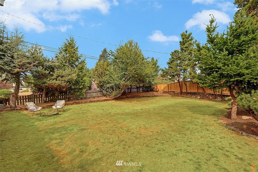 4606 South Adams Street Seattle, WA 98118 - Photo 29 of 29 a view of swimming pool with trees in the background