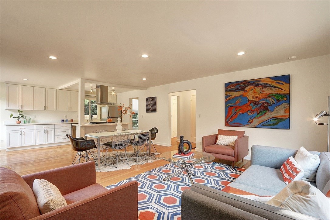 4606 South Adams Street Seattle, WA 98118 - Photo 4 of 29 a living room with furniture and kitchen view