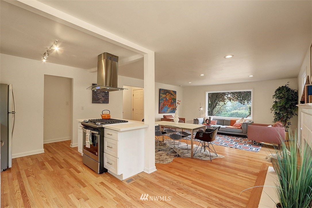 4606 South Adams Street Seattle, WA 98118 - Photo 5 of 29 a living room with furniture large window and a table