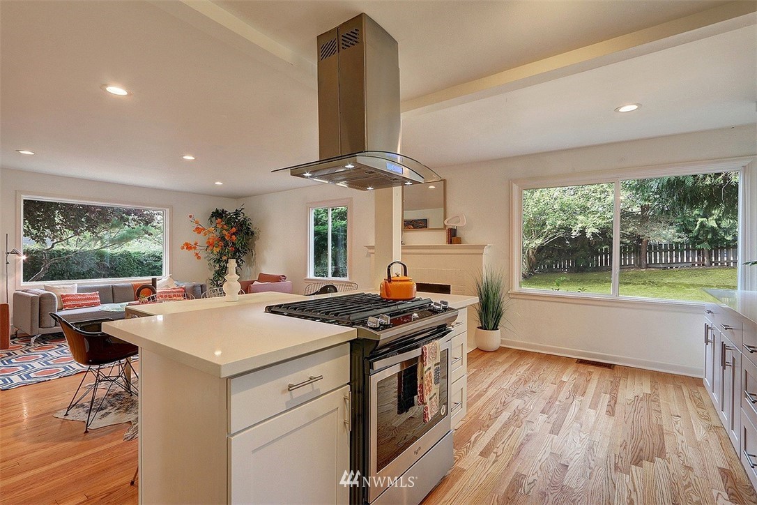 4606 South Adams Street Seattle, WA 98118 - Photo 7 of 29 a kitchen that has a sink and a stove