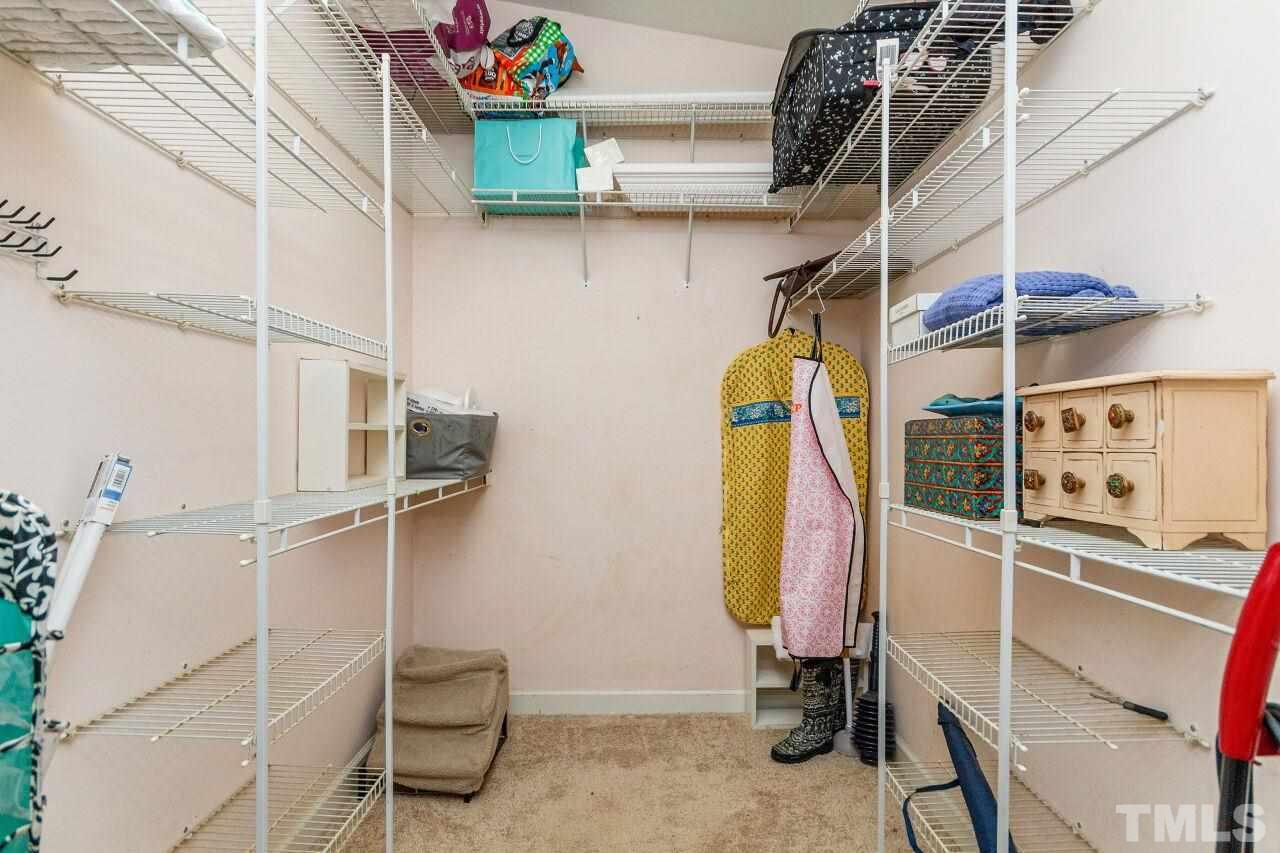 3018 Medlin Drive Raleigh, NC 27607 - Photo 22 of 30 Walk in closet from master bedroom. Great storage here and in the pull down attic. There is also room for expansion as well.