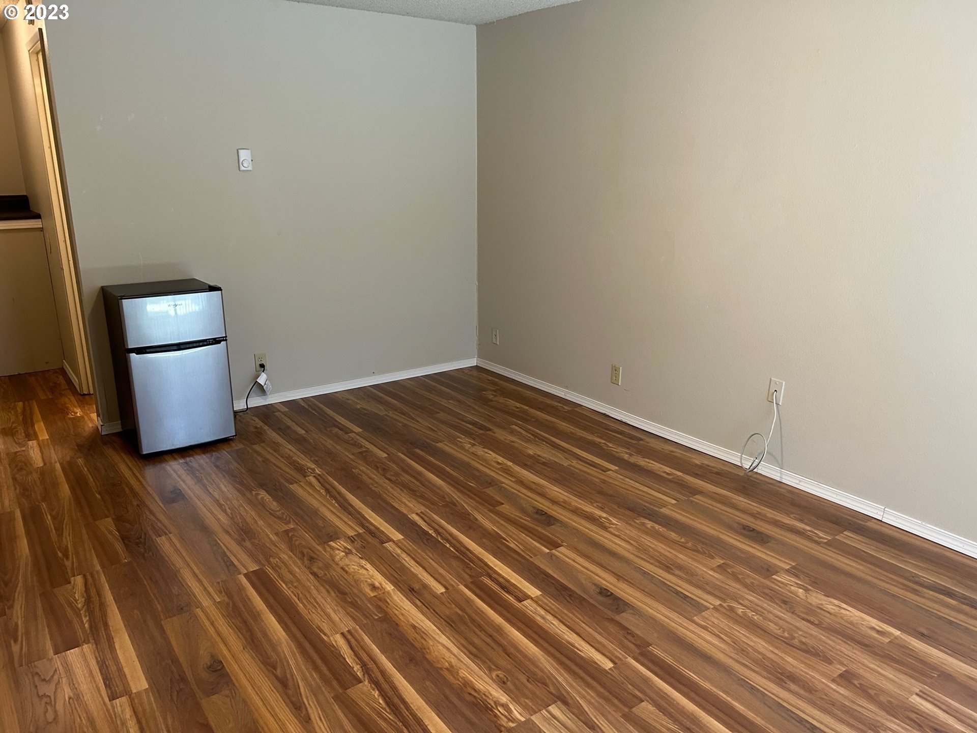 1640 Mill Street Eugene, OR 97401 - Photo 3 of 12 a view of empty room with wooden floor