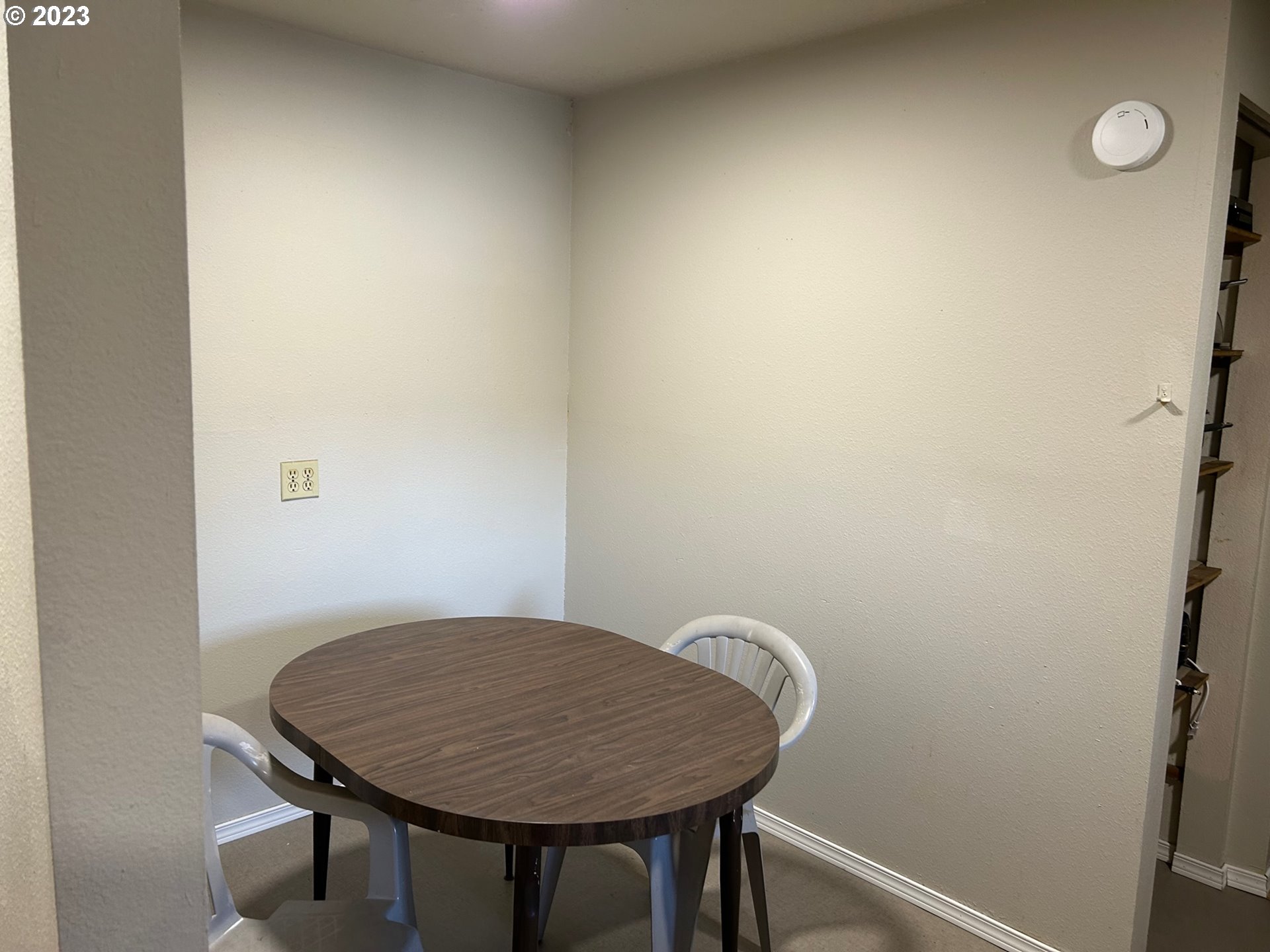 1640 Mill Street Eugene, OR 97401 - Photo 8 of 12 a view of a hallway with a table and chairs