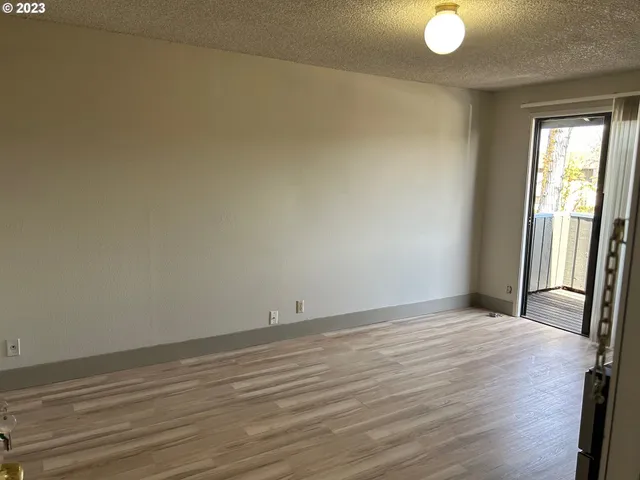 a view of an empty room and window