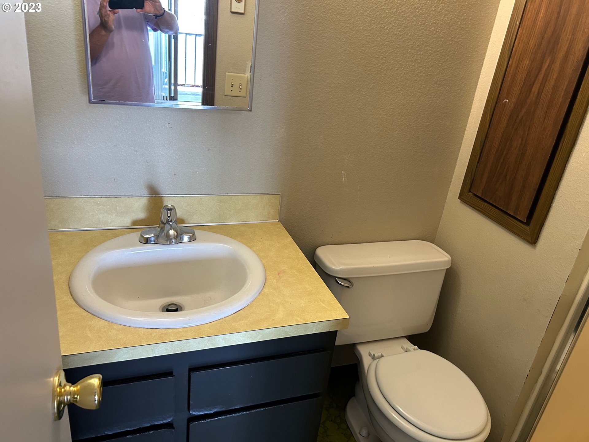 1640 Mill Street Eugene, OR 97401 - Photo 10 of 12 a white toilet sitting next to a bathroom sink
