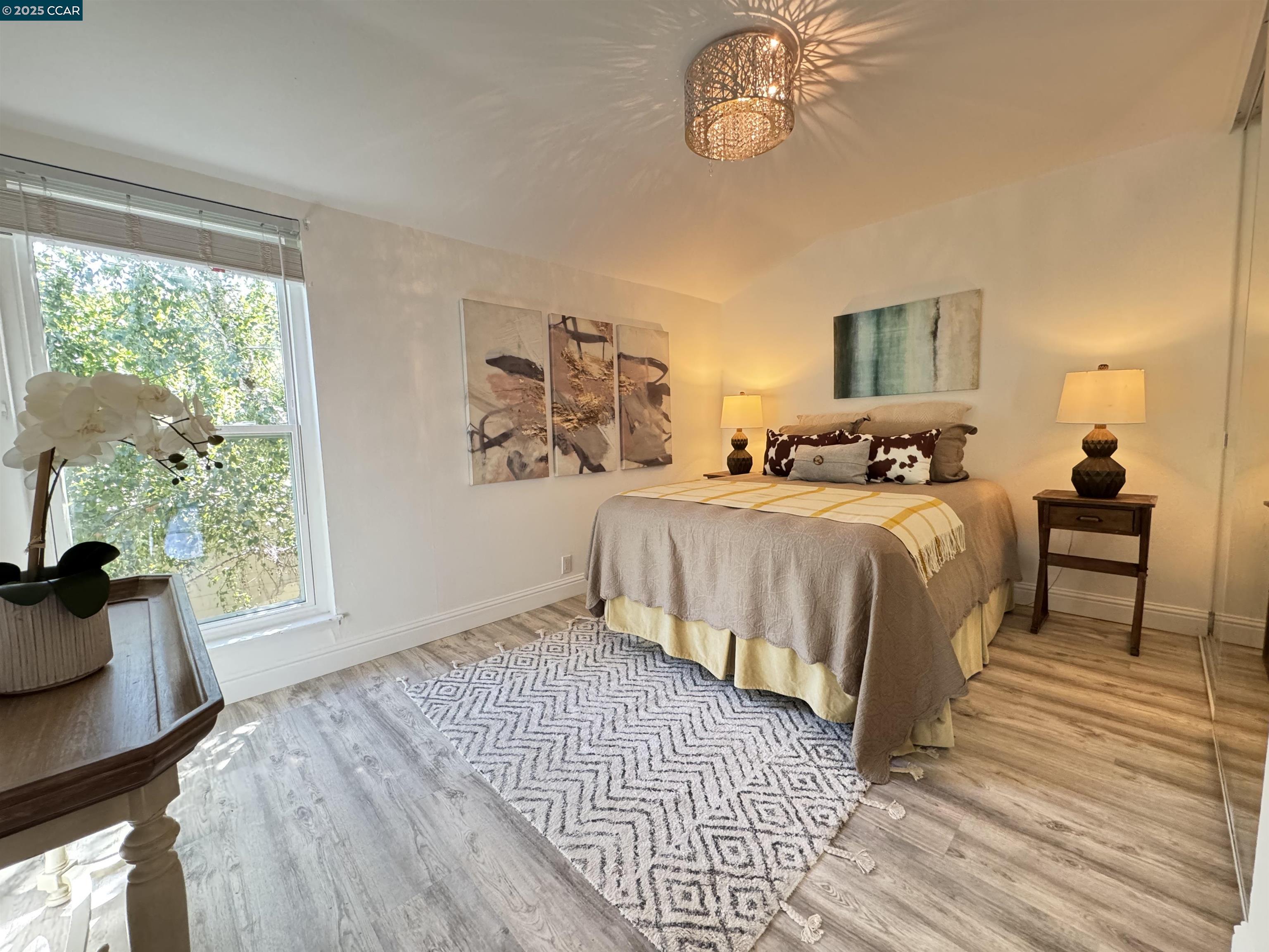 2075 Ascot Drive, Unit 221 Moraga, CA 94556 - Photo 15 of 21 a bedroom with a bed a dresser and next to a window