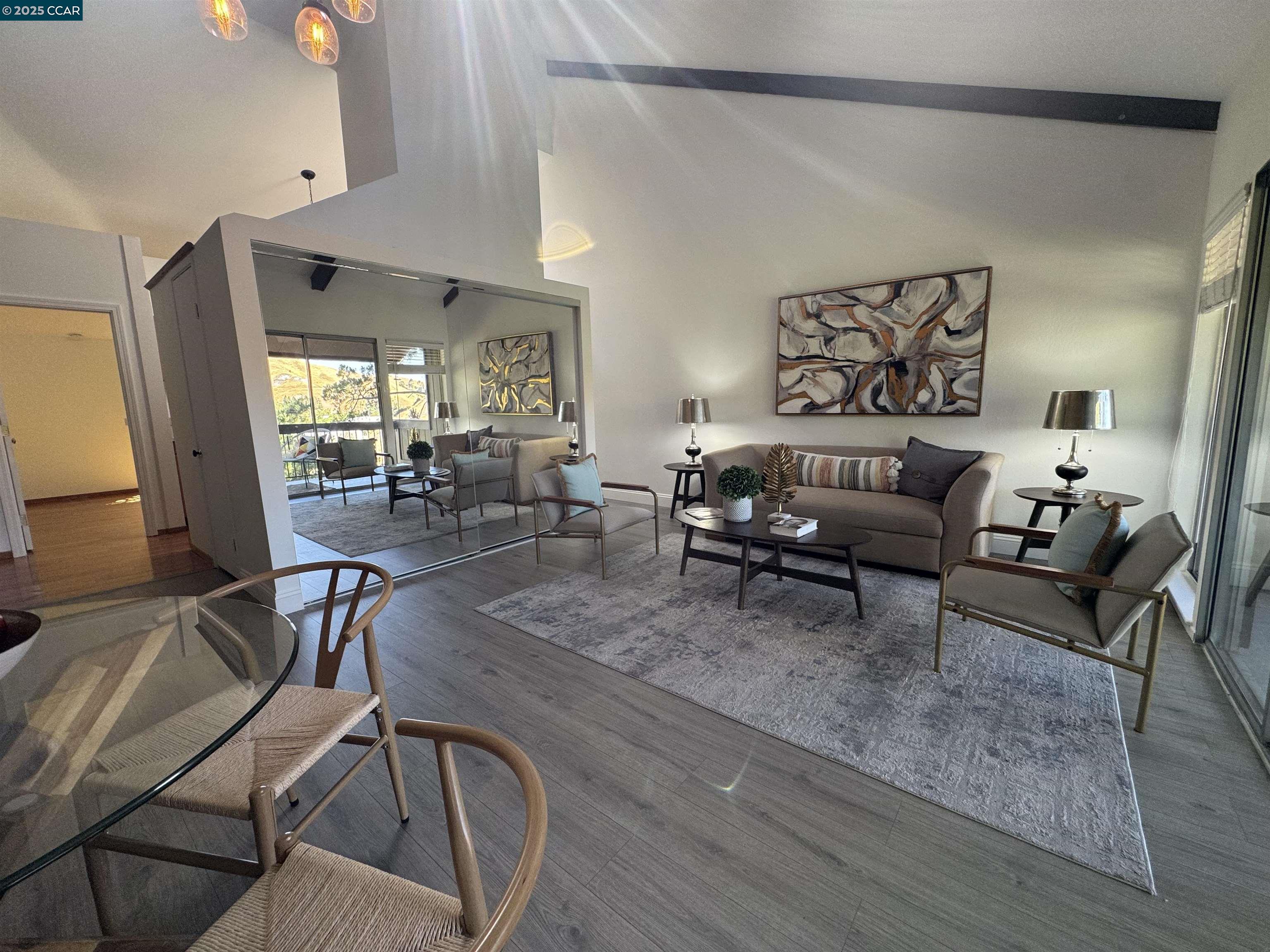 2075 Ascot Drive, Unit 221 Moraga, CA 94556 - Photo 3 of 21 a living room with furniture and wooden floor