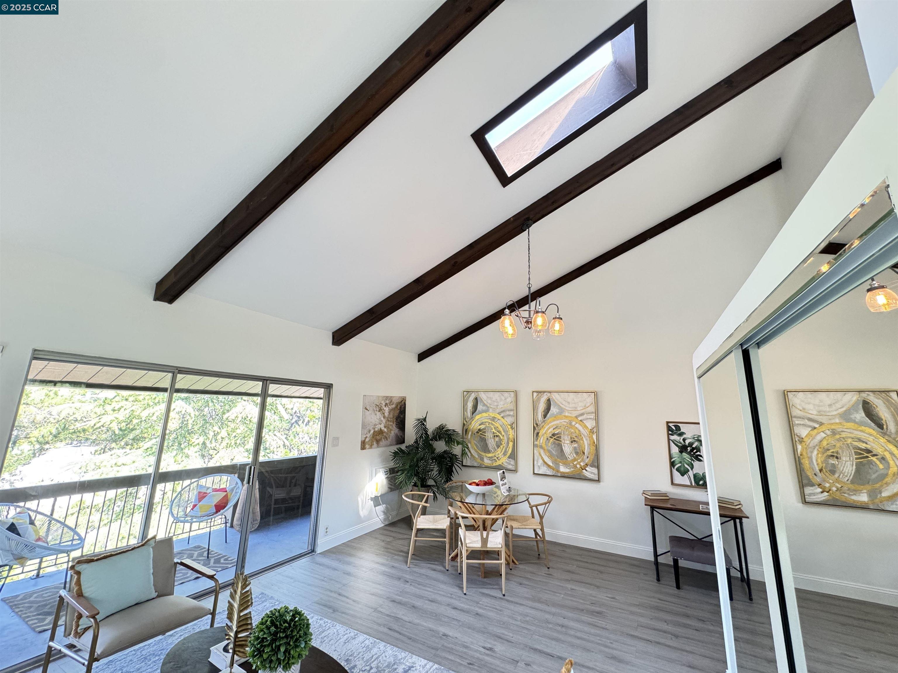 2075 Ascot Drive, Unit 221 Moraga, CA 94556 - Photo 5 of 21 a living room with furniture and a large window