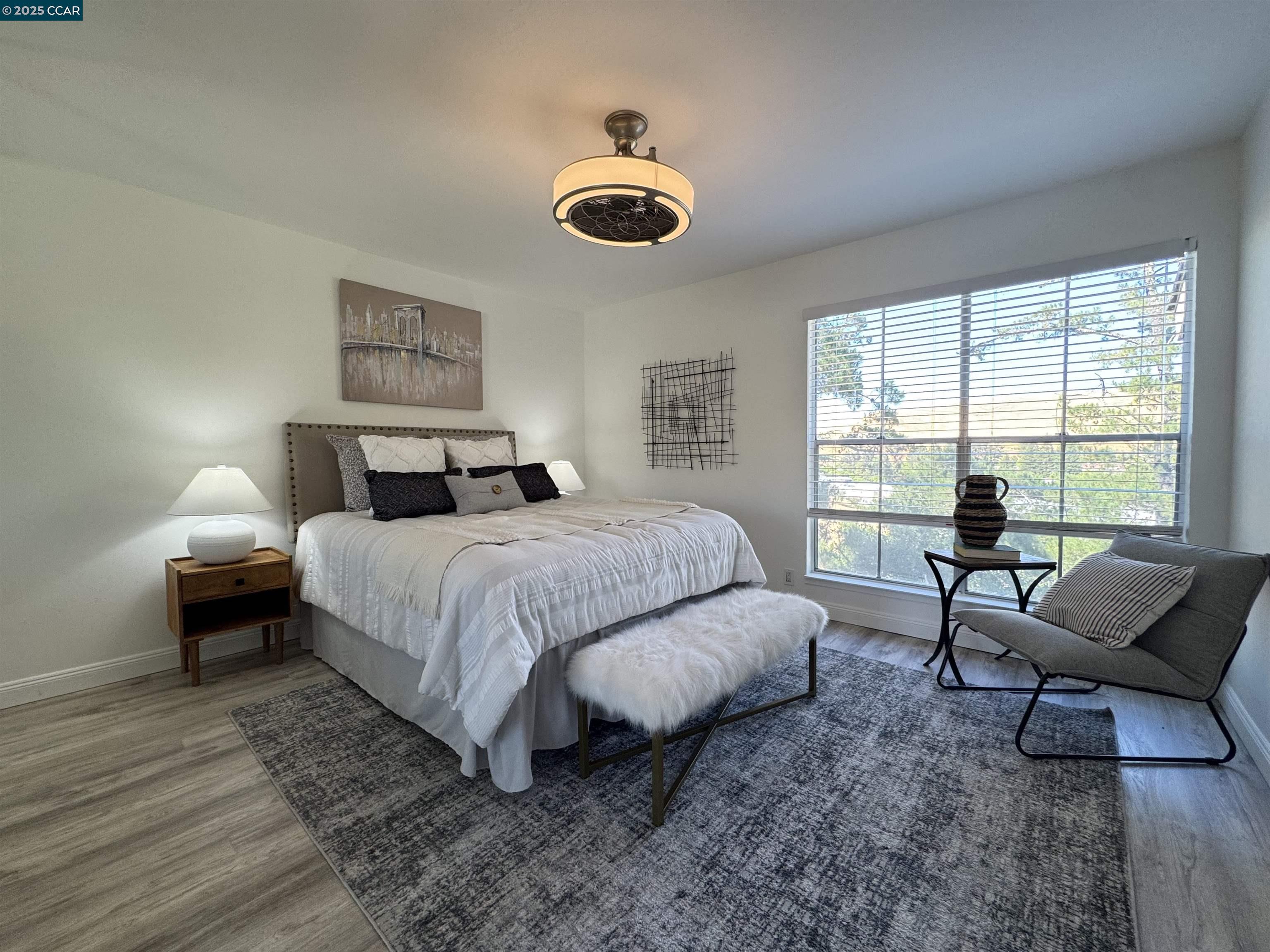 2075 Ascot Drive, Unit 221 Moraga, CA 94556 - Photo 9 of 21 a bedroom with a bed and a window