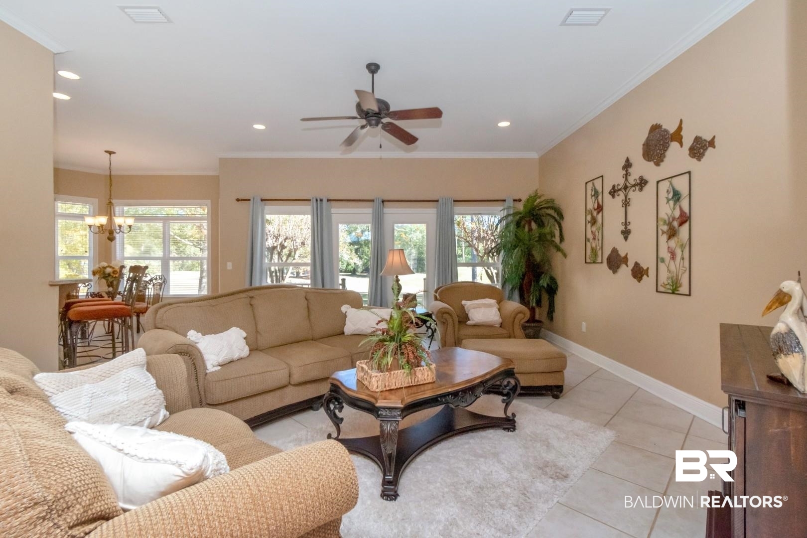 9905 Carnoustie Court Foley, AL 36535 - Photo 5 of 31 Living room featuring tile patterned flooring, a ceiling fan, crown molding, a chandelier, and recessed lighting