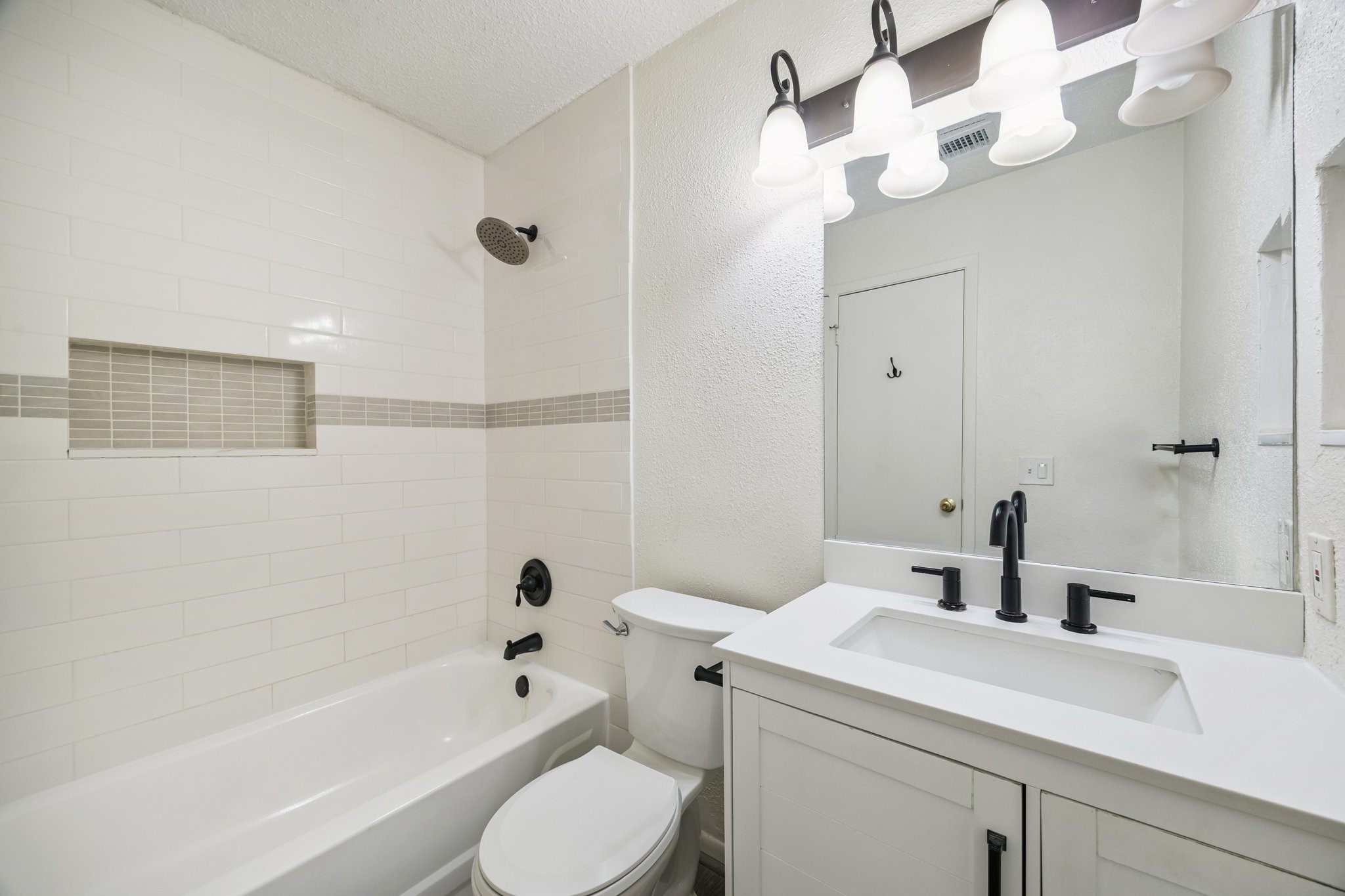 3923 Windmill Street Sugar Land, TX 77479 - Photo 11 of 16 a bathroom with a sink a toilet and shower