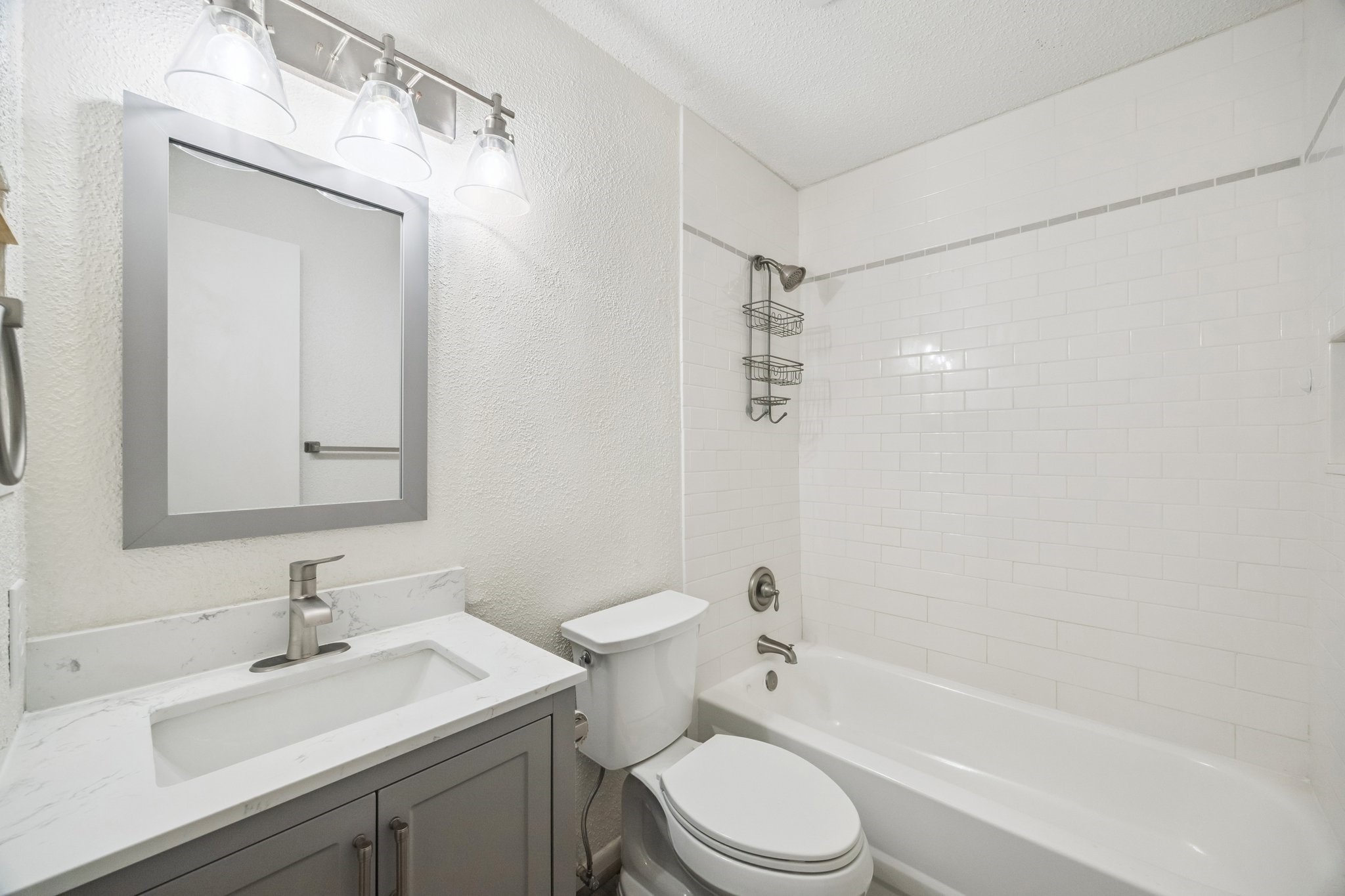 3923 Windmill Street Sugar Land, TX 77479 - Photo 14 of 16 a bathroom with a sink a toilet and shower