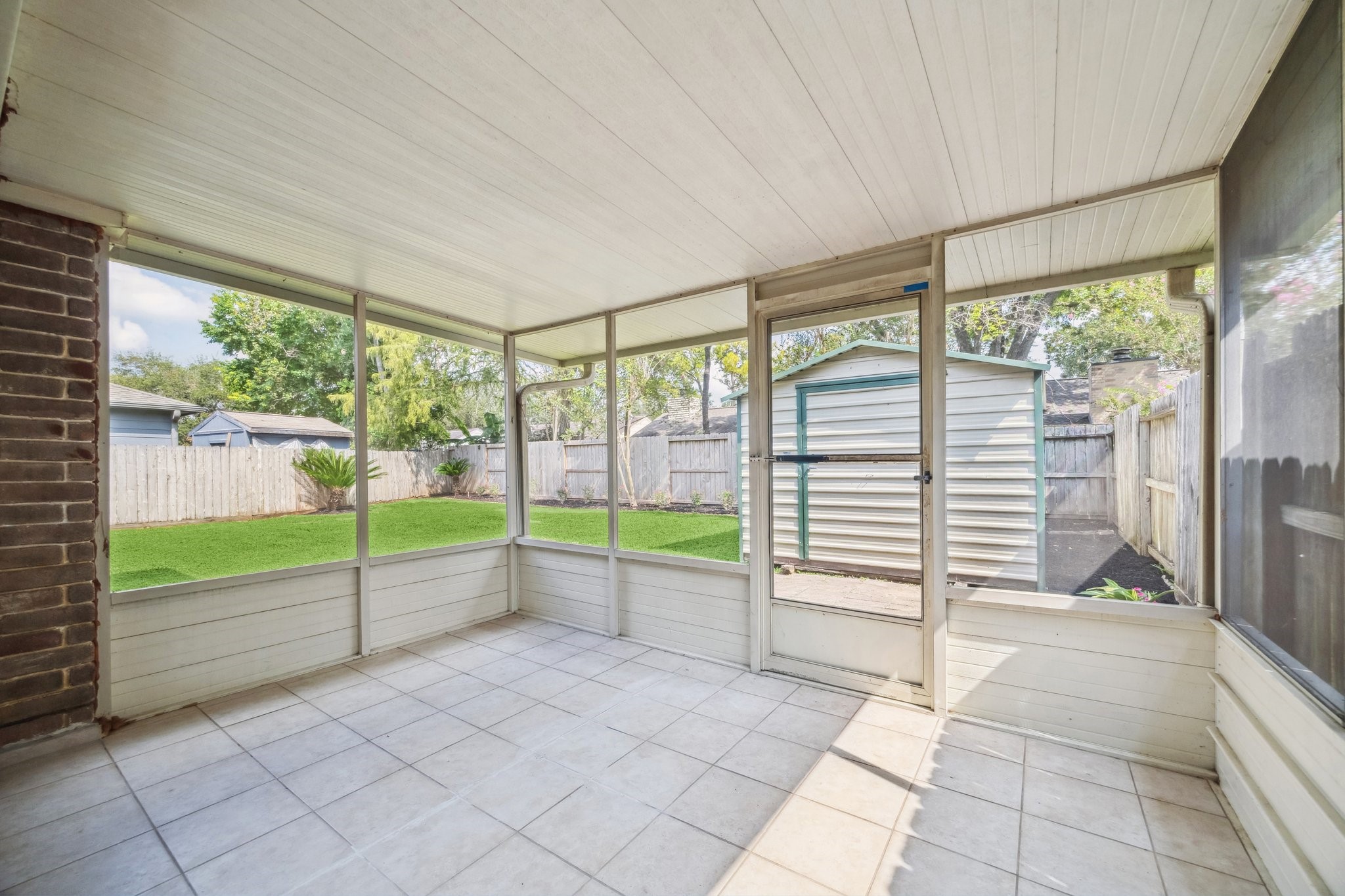 3923 Windmill Street Sugar Land, TX 77479 - Photo 15 of 16 a view of a back yard from a living room