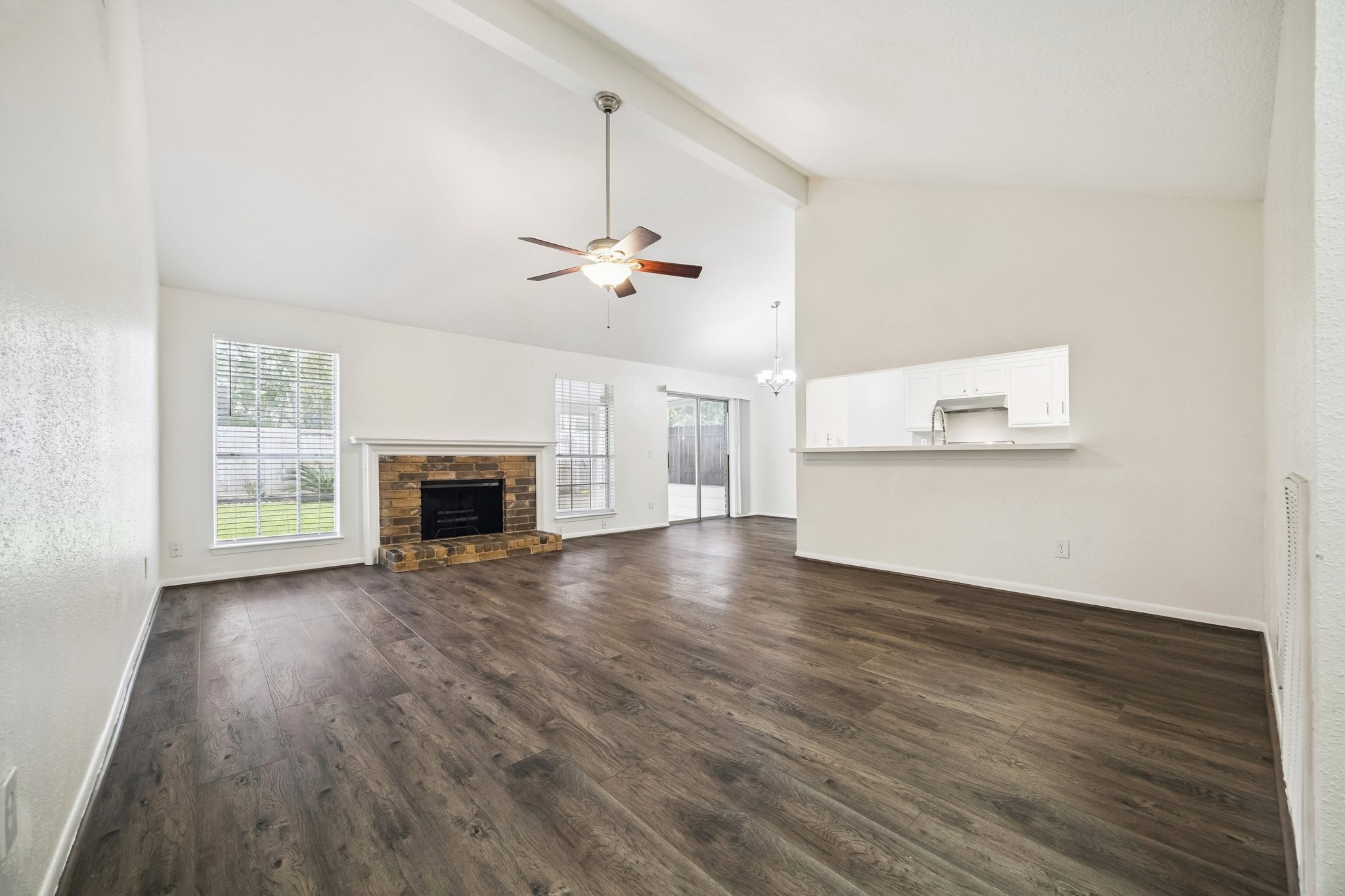 3923 Windmill Street Sugar Land, TX 77479 - Photo 3 of 16 an empty room with wooden floor fireplace and windows