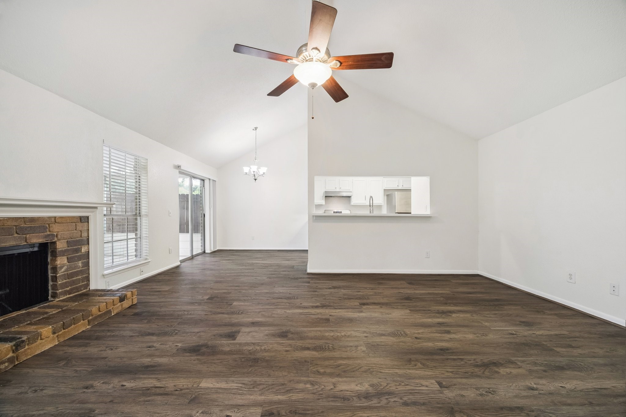 3923 Windmill Street Sugar Land, TX 77479 - Photo 5 of 16 a view of an empty room with a fireplace and a window