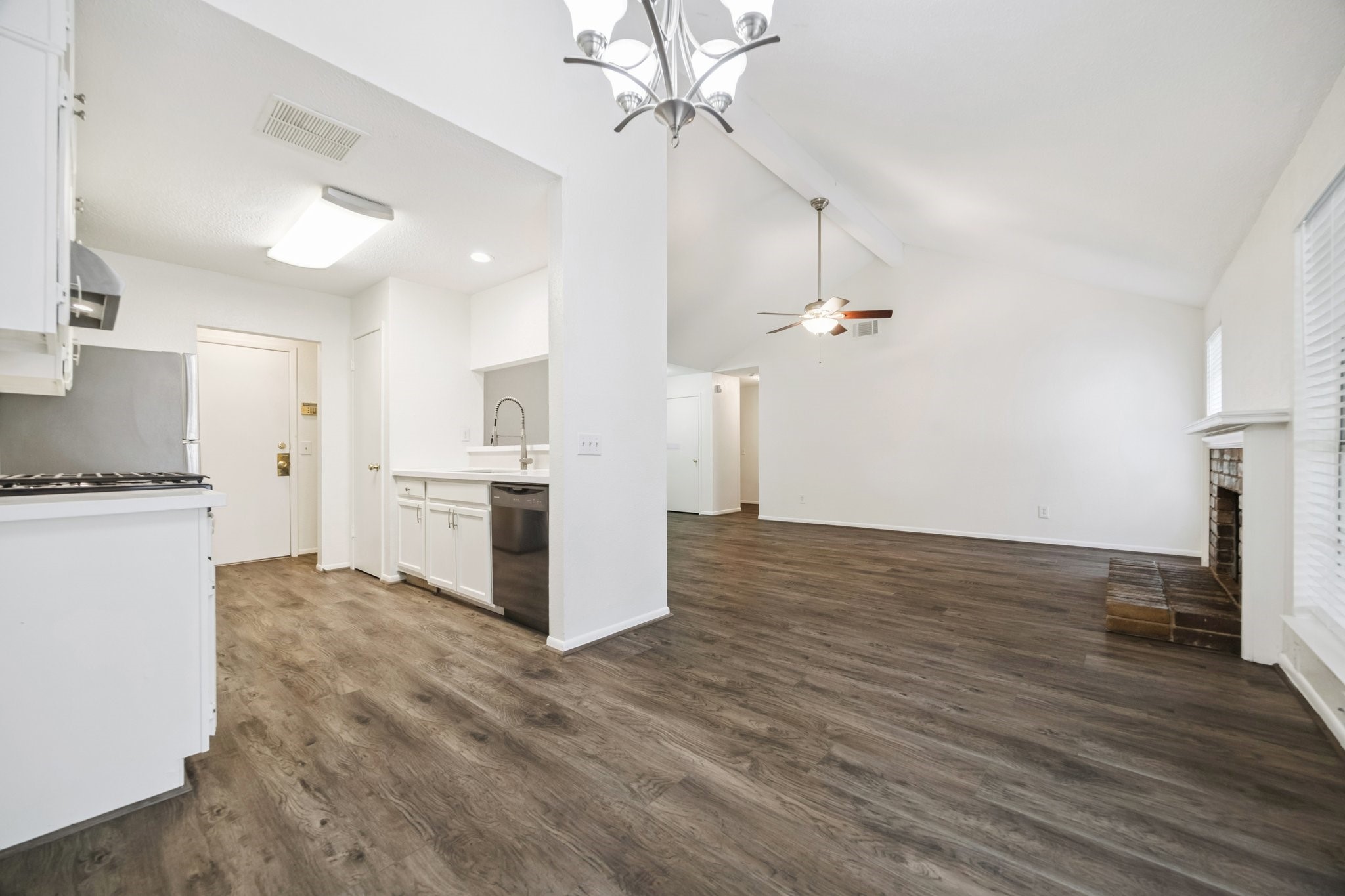 3923 Windmill Street Sugar Land, TX 77479 - Photo 6 of 16 a view of a kitchen with wooden floor and a kitchen