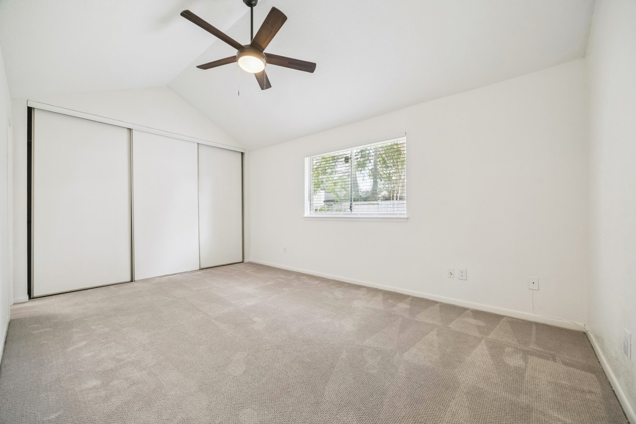 3923 Windmill Street Sugar Land, TX 77479 - Photo 9 of 16 an empty room with a window and a ceiling fan