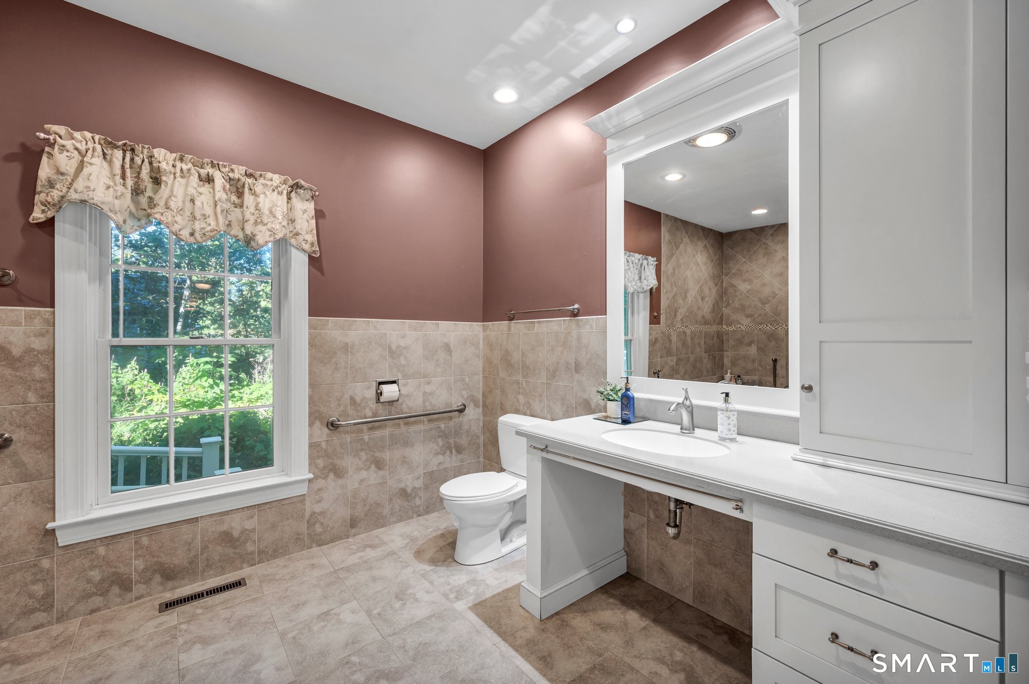 270 Copper Ridge Southington, CT 06489 - Photo 28 of 40 Large, fully wheelchair-accessible bathroom featuring a roll-under sink, roll-in shower, grab bars, and dual shower controls designed for both seated and standing positions.