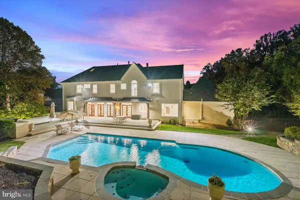 a view of a swimming pool with a patio