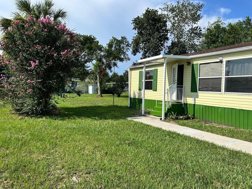 5920 Southwest 62nd Place Ocala, FL 34474 - Photo 13 of 20 front view of a house with a yard