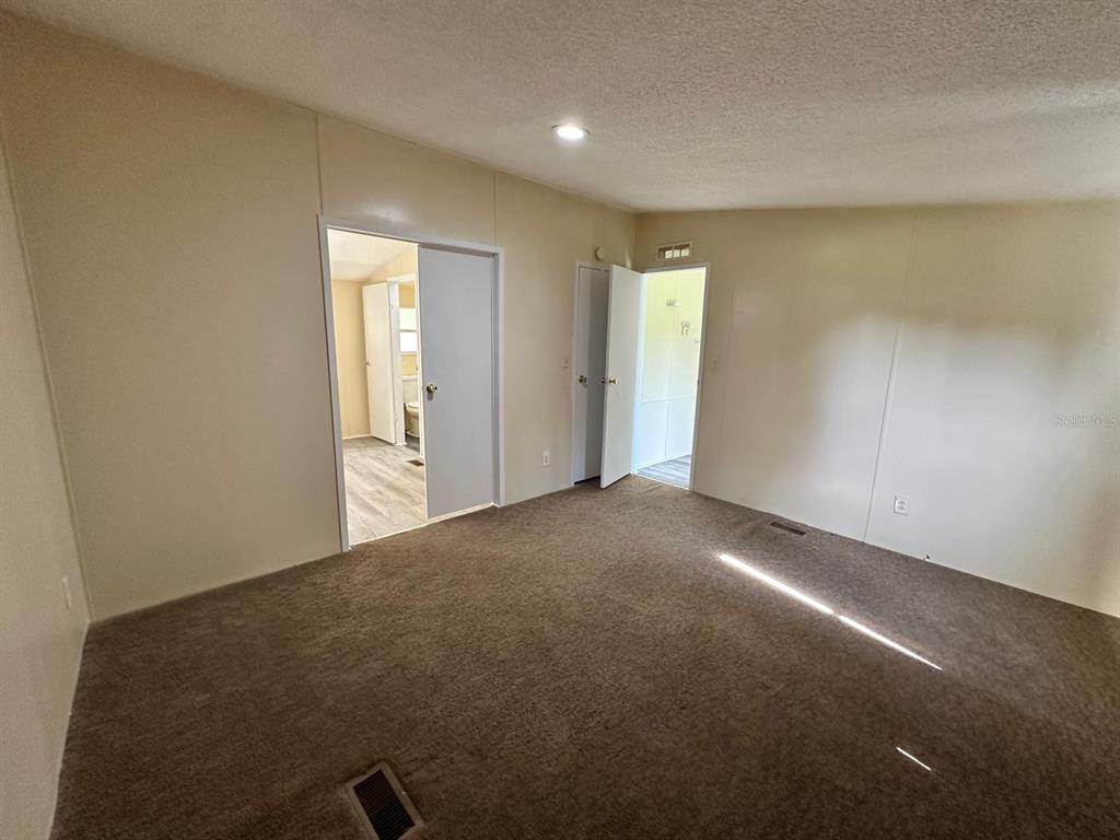 5920 Southwest 62nd Place Ocala, FL 34474 - Photo 15 of 20 a view of an empty room and a windows