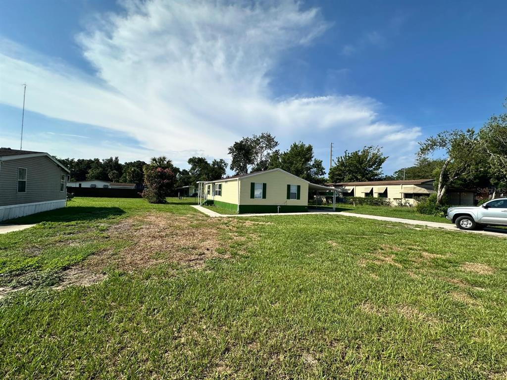 5920 Southwest 62nd Place Ocala, FL 34474 - Photo 3 of 20 a front view of a house with garden