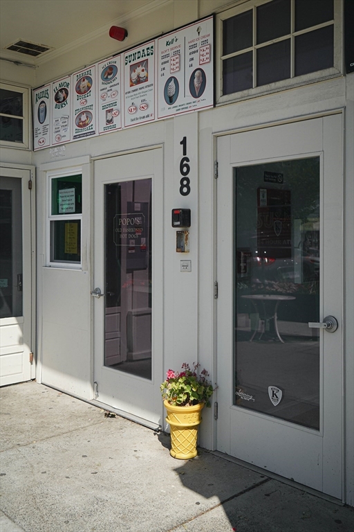168 Humphrey Street, Unit 2 Swampscott, MA 01907 - Photo 23 of 26 a front view of a house with outdoor space and seating space