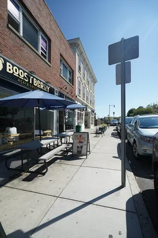 a view of the patio with dining table and chairs