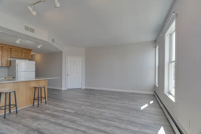 a view of kitchen and wooden floor