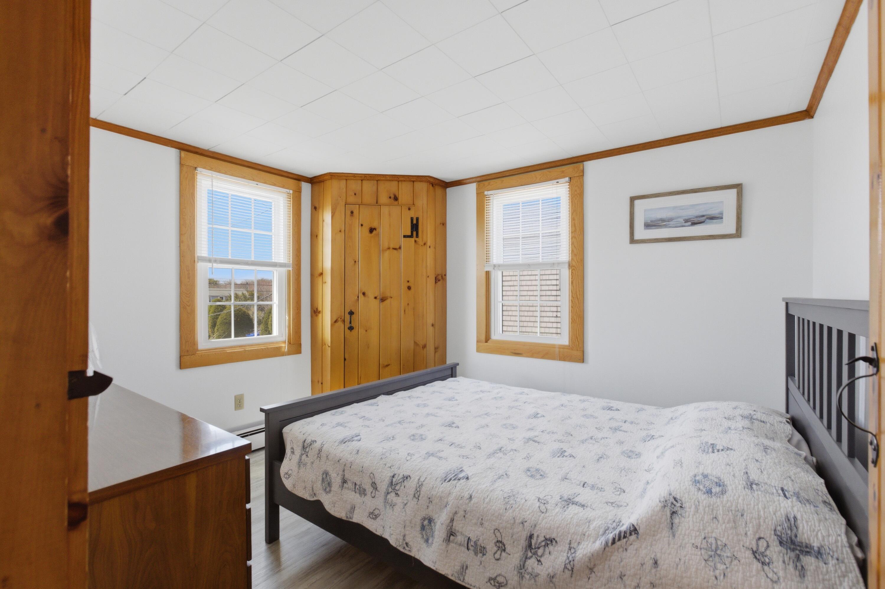 185 Phillips Road Sagamore Beach, MA 02562 - Photo 15 of 37 a bedroom with a bed and a window