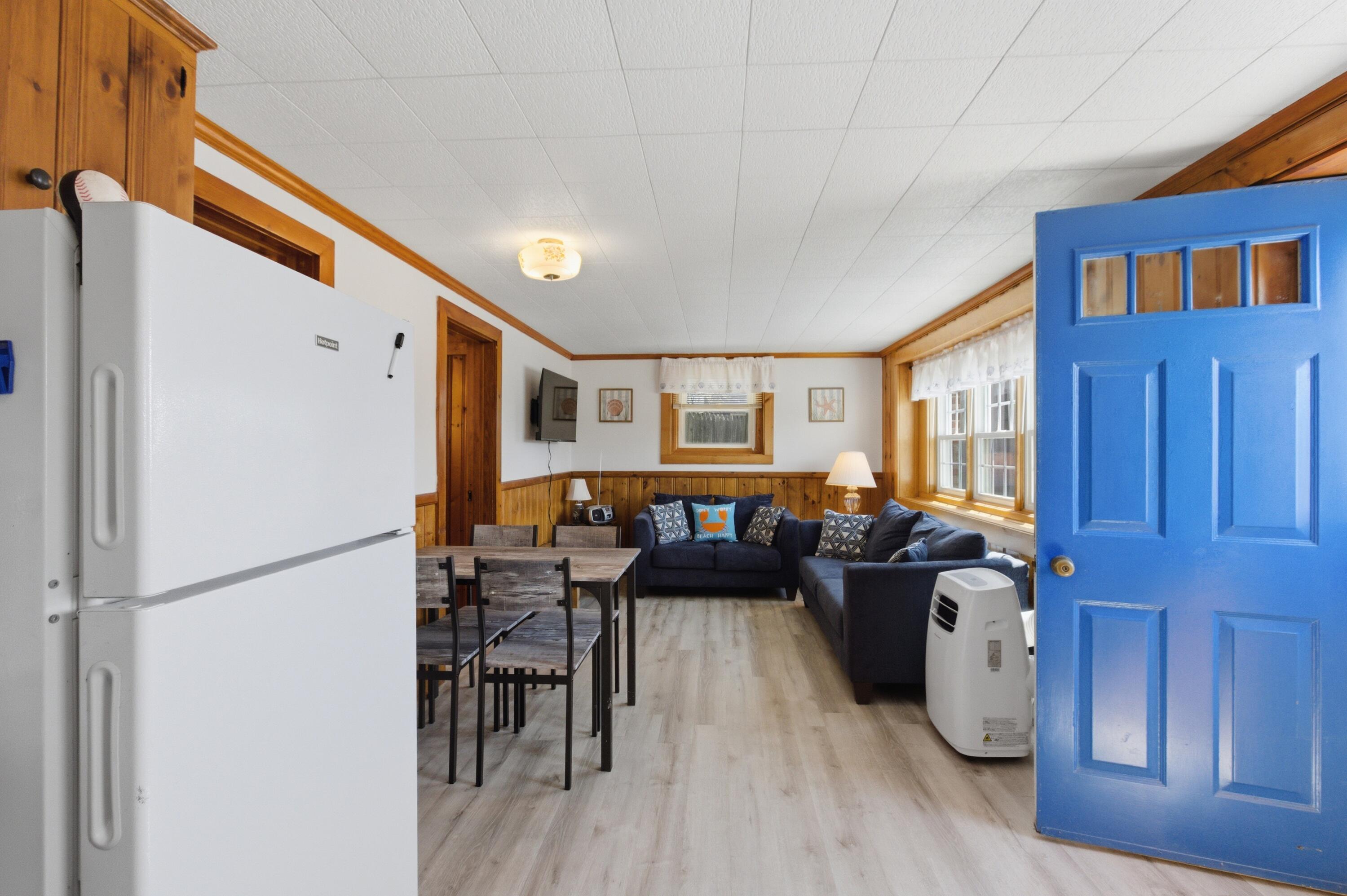 185 Phillips Road Sagamore Beach, MA 02562 - Photo 27 of 37 a living room with furniture and a refrigerator