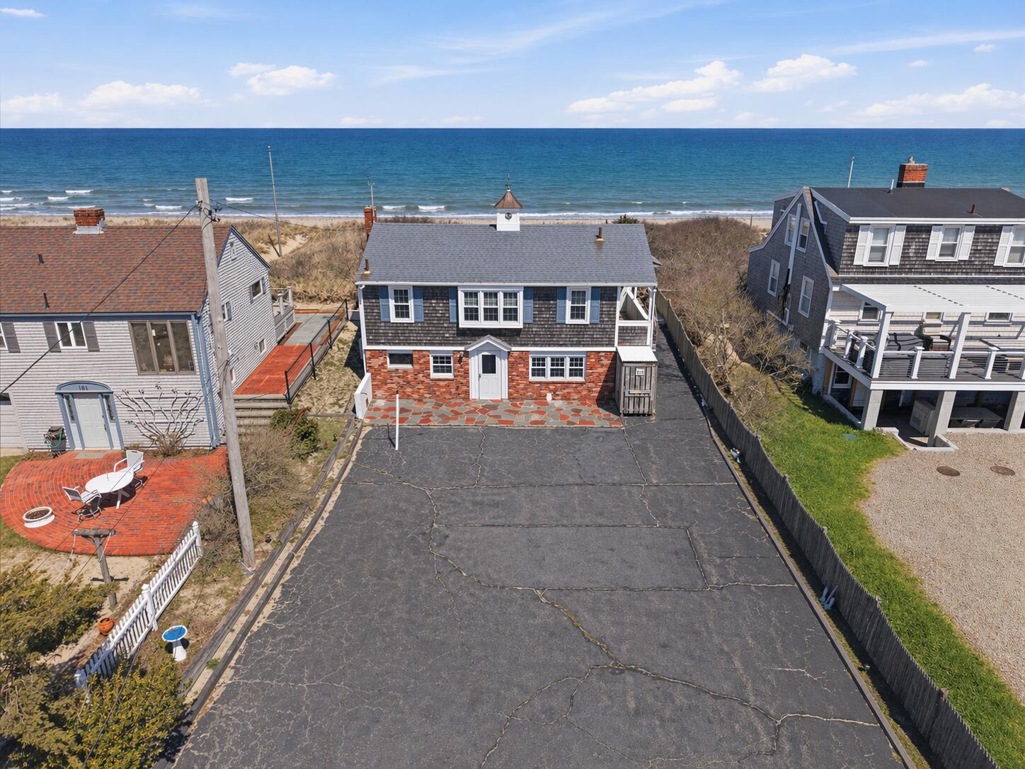 185 Phillips Road Sagamore Beach, MA 02562 - Photo 4 of 37 an aerial view of a house with swimming pool