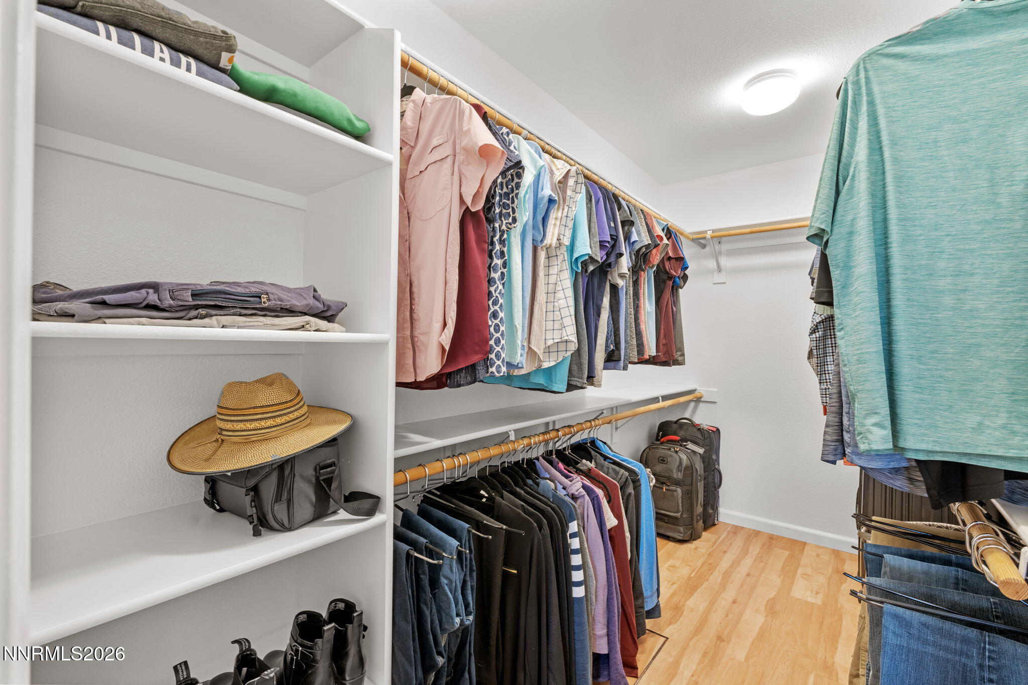 18324 Panda Bear Court Reno, NV 89508 - Photo 17 of 44 a view of walk in closet with clothes and shoes