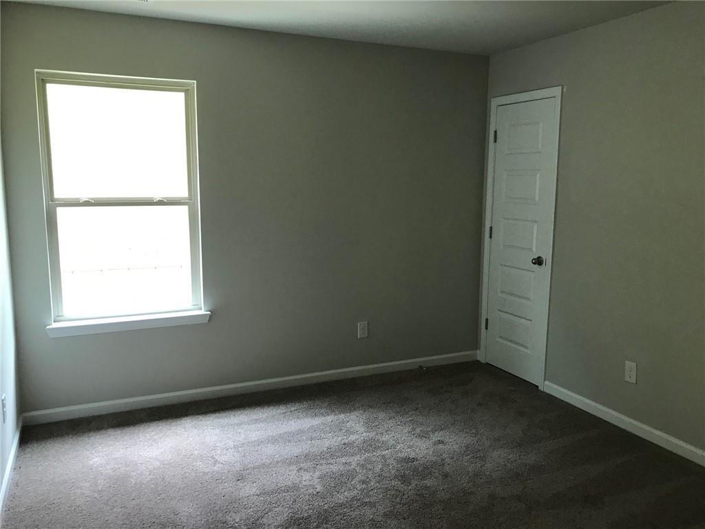 213 Creek View Place Canton, GA 30114 - Photo 6 of 10 an empty room with a window