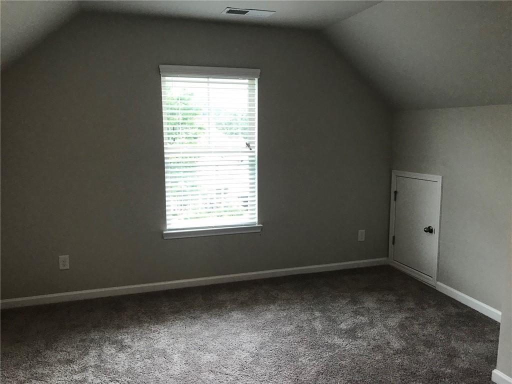 213 Creek View Place Canton, GA 30114 - Photo 8 of 10 an empty room with a window