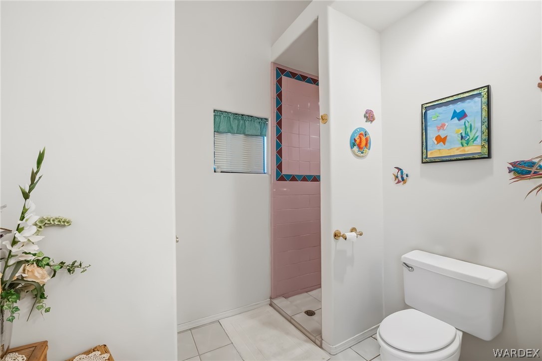2401 North Stephan Road Kingman, AZ 86401 - Photo 46 of 92 a white toilet sitting next to a bathroom sink