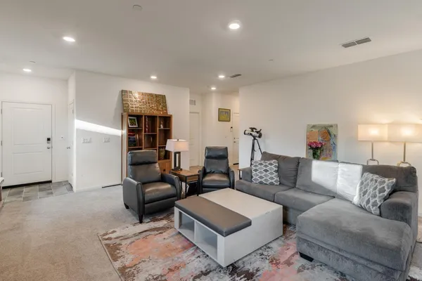 a living room with furniture and a couch