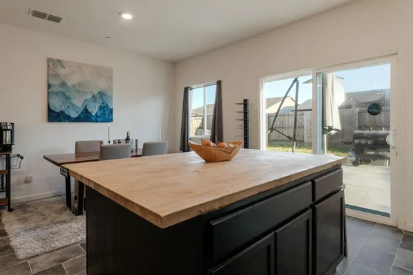a kitchen with a stove and a refrigerator