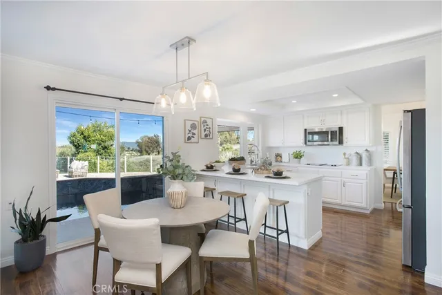 a view of a dining room with furniture window and outside view