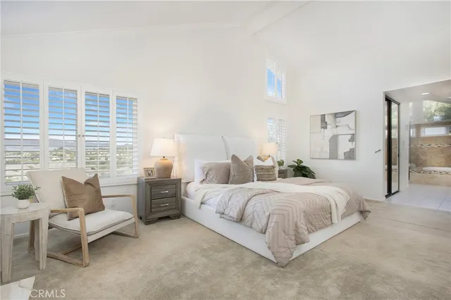 an aerial view of residential houses with outdoor space and parking