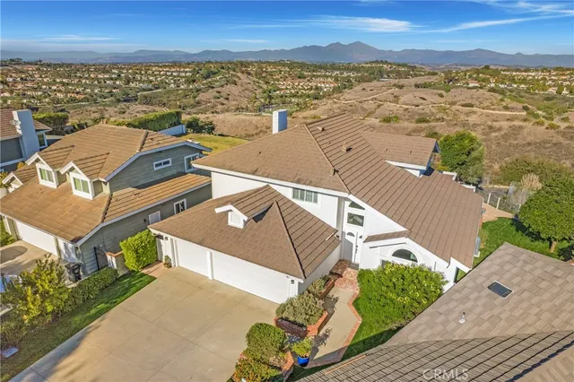 a view of a patio with couches table and chairs and potted plants