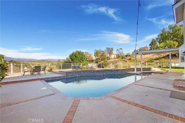 a view of a patio with swimming pool