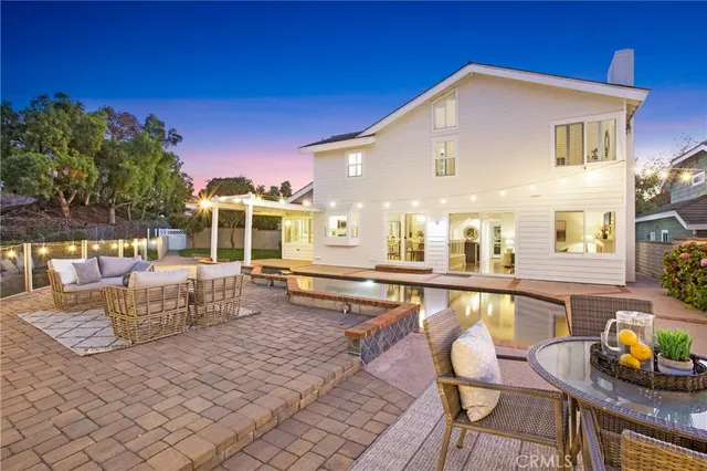 a living room with furniture and a painting