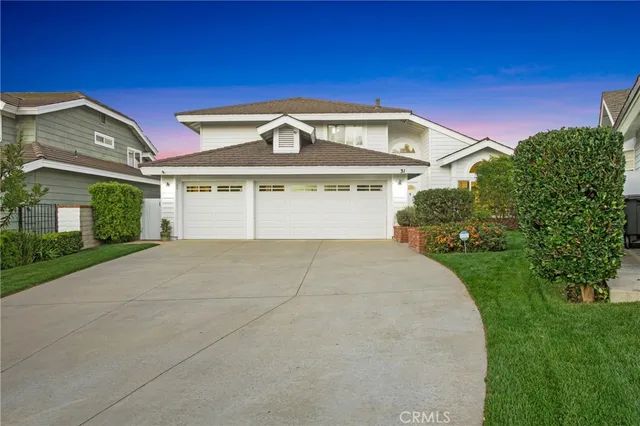 a view of a living room with furniture and a potted plant