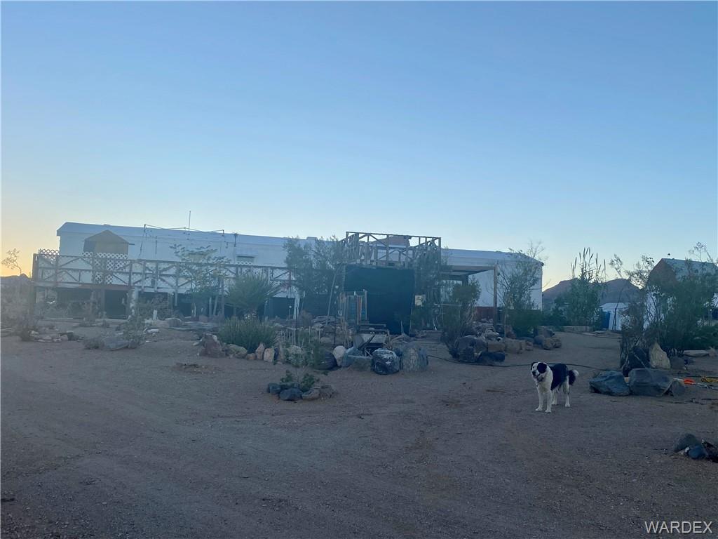 1730 Guthrie Road Golden Valley, AZ 86413 - Photo 46 of 51 a view of a dry yard with trees