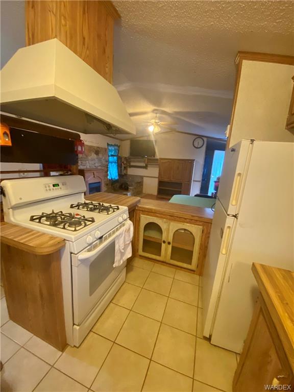 1730 Guthrie Road Golden Valley, AZ 86413 - Photo 10 of 51 a kitchen with stainless steel appliances a stove a sink and a refrigerator