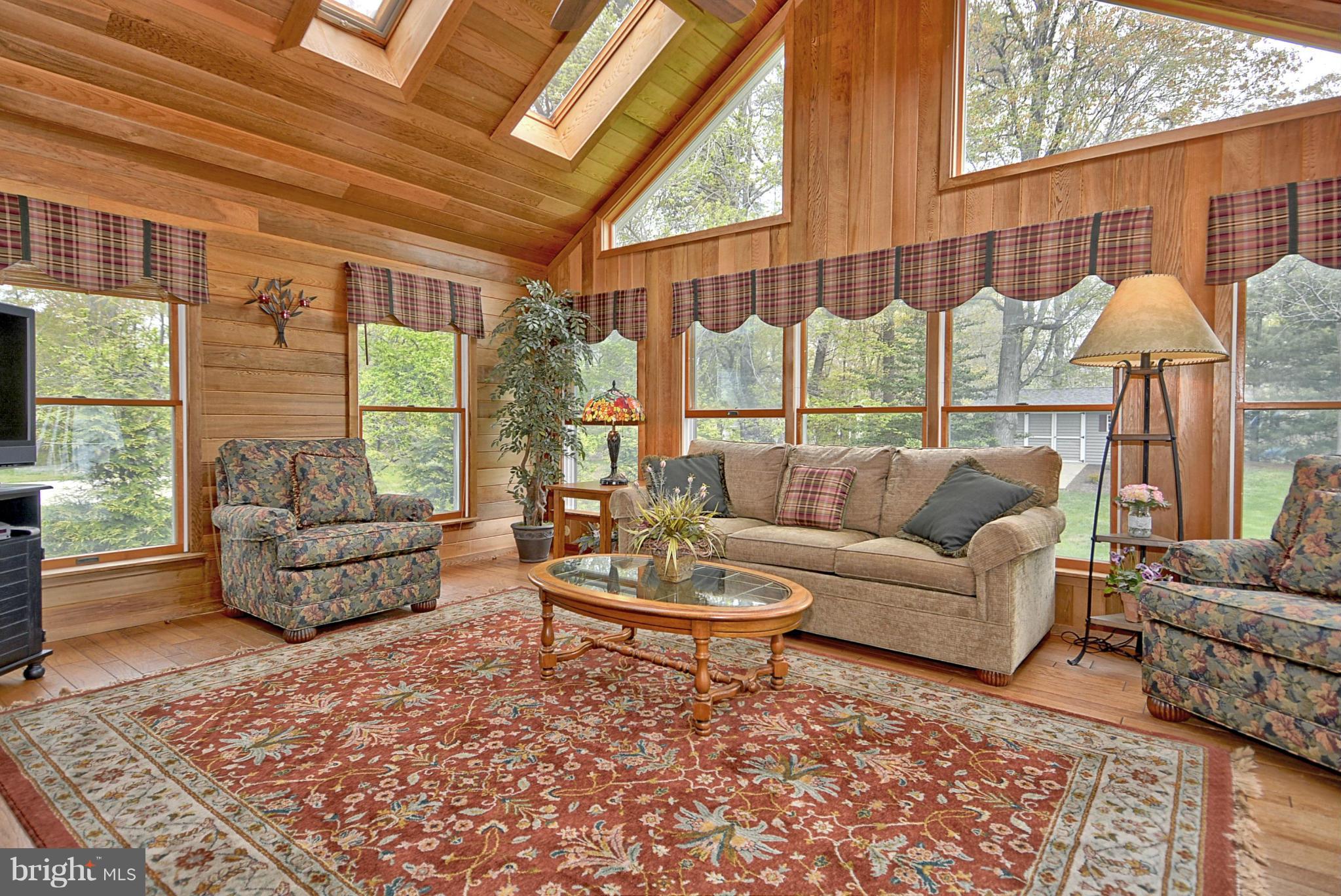 7719 Water Oak Point Road Pasadena, MD 21122 - Photo 11 of 20 Sunroom w/Cathedrals, Hardwoods, Heat & AC