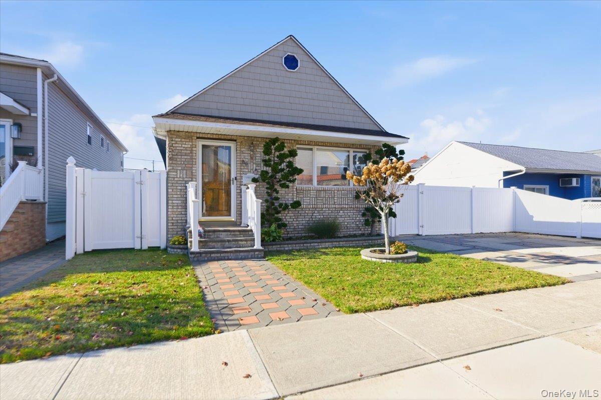 a front view of house with yard