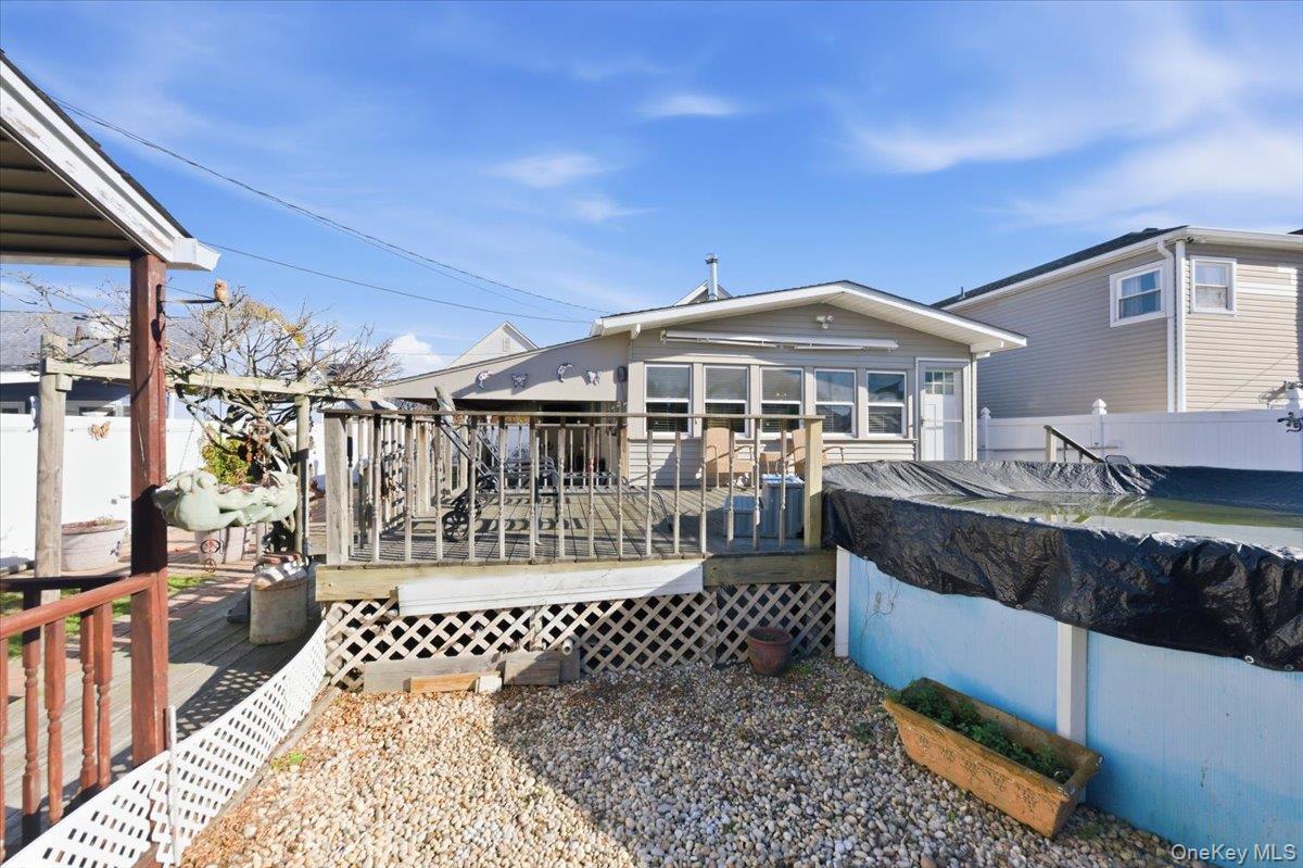 80 Newport Road Island Park, NY 11558 - Photo 18 of 26 a front view of a house with a porch