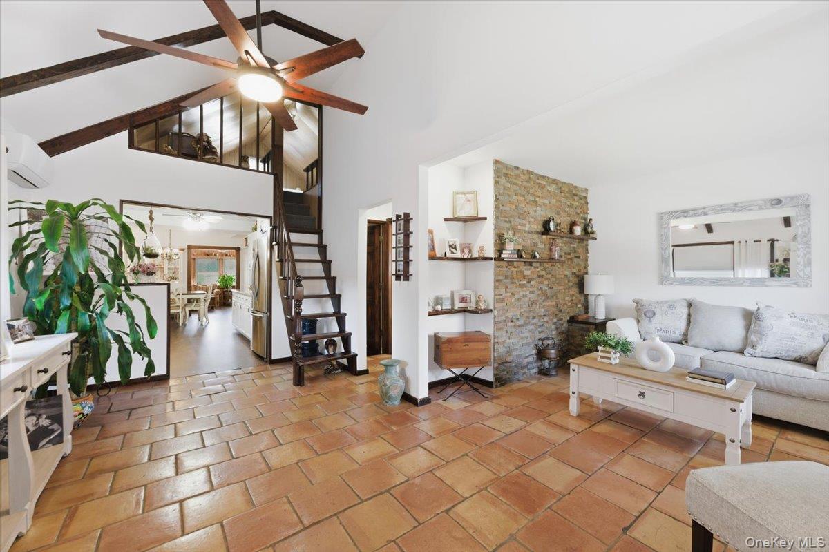 80 Newport Road Island Park, NY 11558 - Photo 2 of 26 a living room with furniture and a potted plant